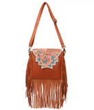 The Sunny Jo Fringe Crossbody Bag in a white back ground.