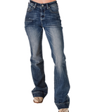 The bottom half of a girl wearing the Dare Me Trouser Jeans. She is in a white back ground.