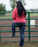 Model wearing Denim Flannel jeans behind gate 