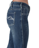 Model wearing Cowgirl Tuff Denim Flannel Jeans in barn stall 