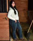 Woman standing in a stall door