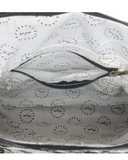 Close-up of interior of a bag with branded "Myra" patterns on a white background