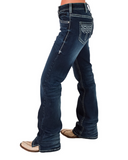 Dark blue jeans worn by a person on a white background