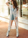 Model posed showing off embroidered details on the duster.