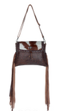 Front view of the Carved Blossoms Leather & Hairon Bag in a white back drop.