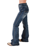 The bottom half of a girl wearing the Dare Me Trouser Jeans. She is standing sideways to show the side seams of the jeans. She is in a white back ground.