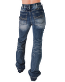 The bottom half of a girl wearing the Dare Me Trouser Jeans. She is turned around to show the back of the jeans. She is in a white back ground.
