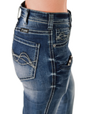 Zoom in of the Dare Me Trouser Jeans, showing the waist band and pockets. The model is in a white back ground.
