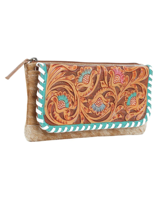 A western-style leather clutch wallet featuring hand-tooled floral patterns in brown, orange, and turquoise, with a white and turquoise striped border and a tan faux fur trim.