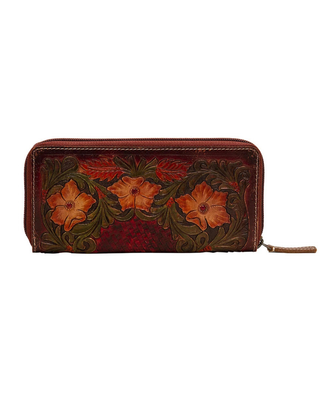 A dark red leather zip-around wallet featuring hand-tooled floral designs with orange flowers and green leaves, shown against a plain white background.