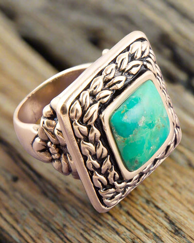 Turquoise ring on wood