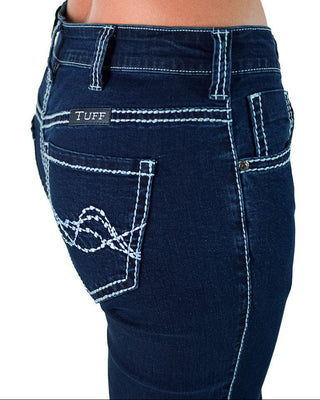 Close-up of the back waist and pockets of dark blue denim jeans with white contrast stitching. A small black brand patch reading 'TUFF' is visible on the back pocket.