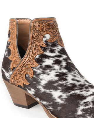 Cowhide leather boot with intricate brown tooled design on a white background