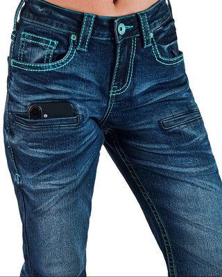 Close-up of a person wearing dark blue denim jeans with bright turquoise contrast stitching and a phone tucked into the front pocket.