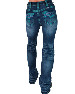 Rusty blue denim jeans with turquoise embroidered details on the back pockets, shown from the back on a model against a white background.
