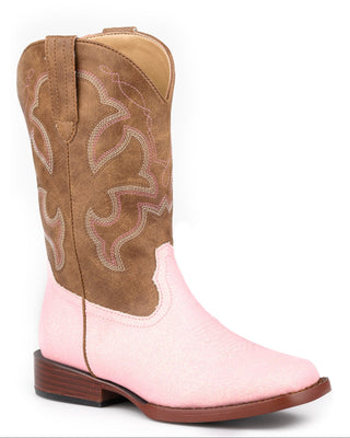 Girl's Gretchen boot by Roper, angled view of a pink glitter vamp, brown faux leather shaft with pink and cream western stitching, pull tabs and a wide square toe