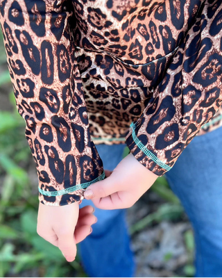 Hear Me Roar Leopard Pullover with Turquoise Zip by Sterling Kreek – Apparel from Bronco Western Supply Co.