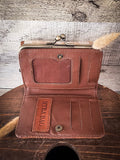 Inside of the Mesa Terra Vintage Style Wallet displayed on a wood table.