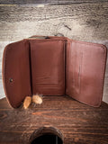 Inside of the back of the Mesa Terra Vintage Style Wallet displayed on a wood table.