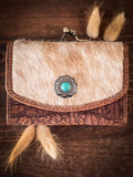 Front view of the Mesa Terra Vintage Style Wallet along with some wheat on a wood table.