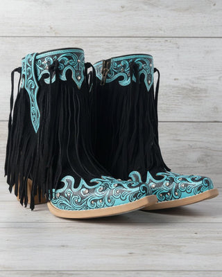 Black cowboy boots with turquoise embroidery and fringes on a white background