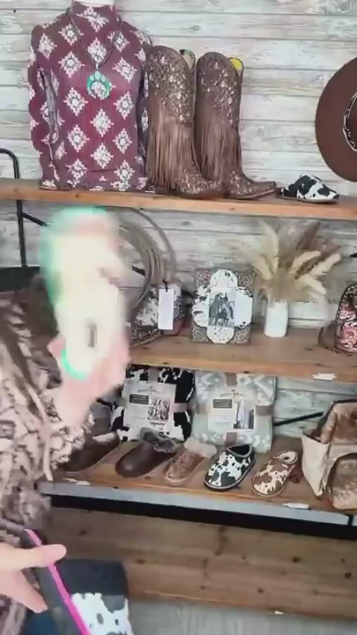 These cowprint slippers said “homebody, but make it western.” 🐄💖

The Alala Slippers are cozy, colorful, and way too cute to not toss in your cart. Soft fleece lining, cushy soles, and two fun color options—brown + turquoise or black + pink.

🐮 Warm + fuzzy on the inside
🐮 Cowprint on the outside (duh)
📦 Free shipping over $150

Because your feet deserve a little yeehaw, too.