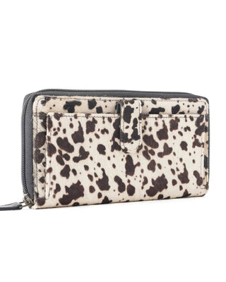 Zip-around wallet with dalmatian print on a white background