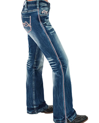 Blue jeans with pink stitching on a white background