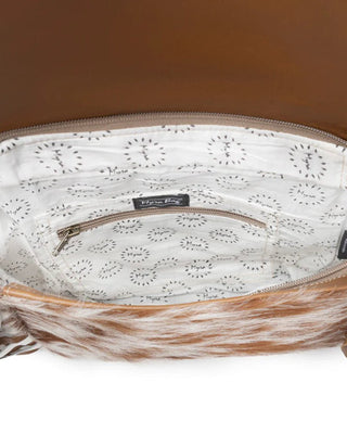 Close-up of a brown leather handbag with white interior lining on a white background