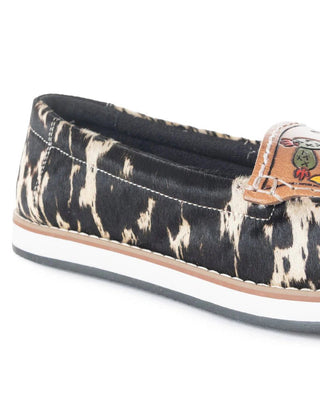 Black and white patterned slip-on shoe with colorful side strip on a white background