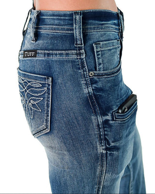 Close-up of blue jeans with a visible brand label on a white background