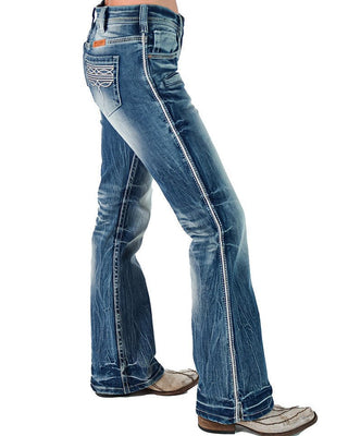 Blue jeans worn by a person on a white background
