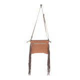 Back view of the Sandy Rosewood Hand-Tooled Bag in a white back drop.